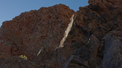 Brown-Rock-Formation-Seen-from-Boat,-Point-of-View,-Tour-of-Rocks-Created-by-Nature