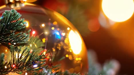 close-up of a golden christmas ornament on a christmas tree