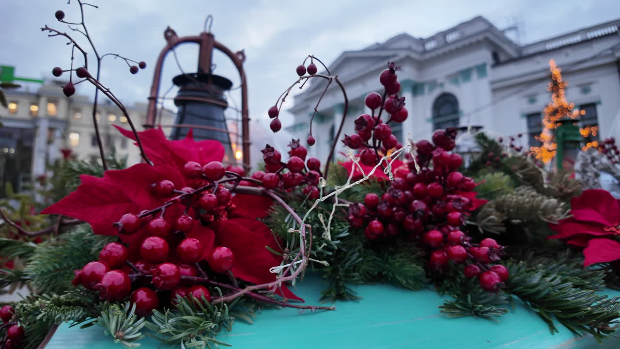 Red christmas decorations with fir tree branch in the evening