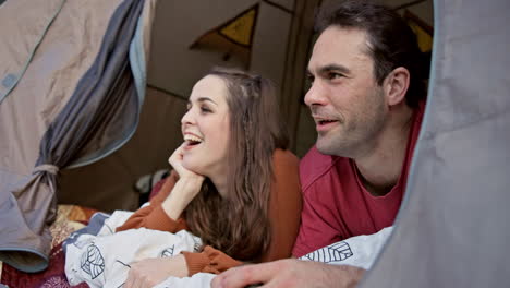 Camping,-tent-and-conversation-with-couple