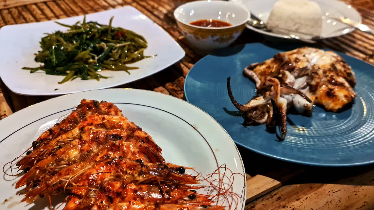 Closeup shot of fried shrimps and octopuses served with rice at a restaurant in Lombok, Indonesia