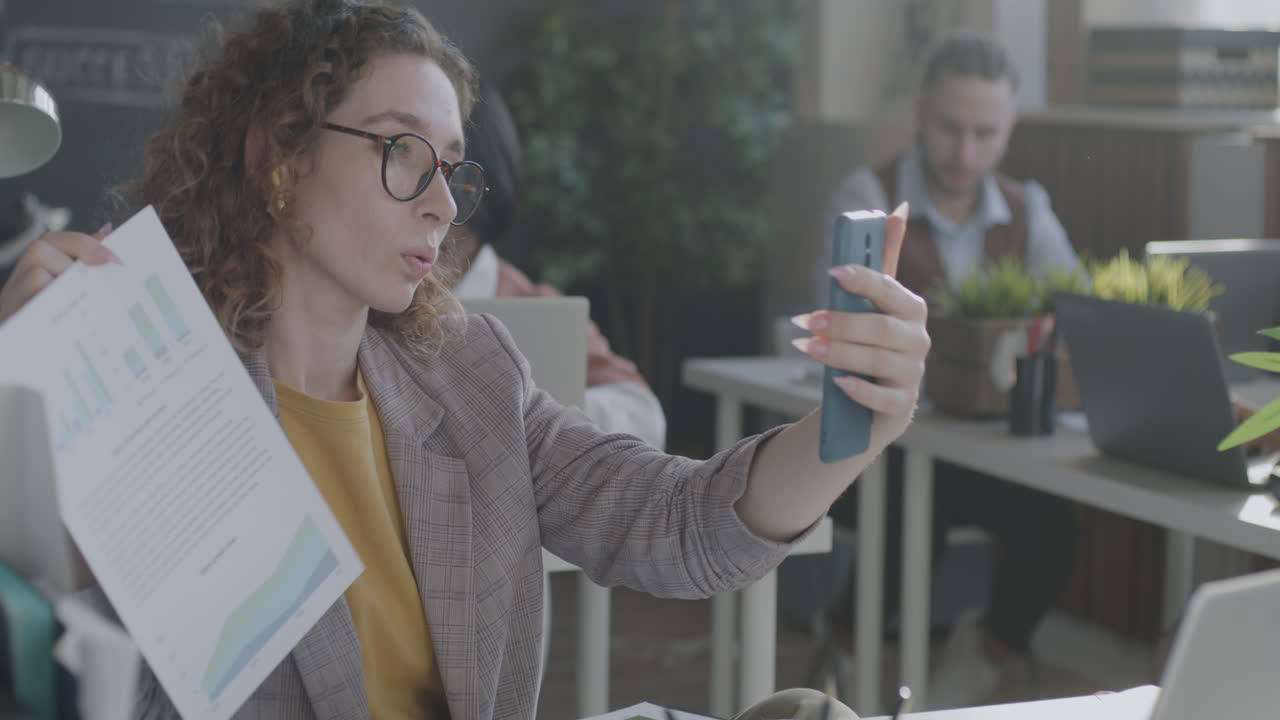 Woman Video Conferencing in Office