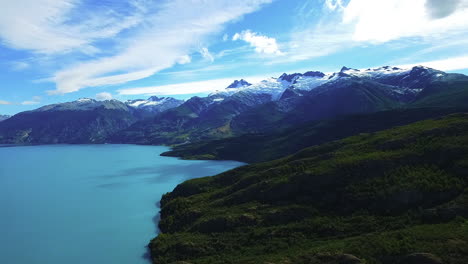 AERIAL---The-Andes-Mountains-and-General-Carrera-Lake,-Chile,-wide-shot-rising