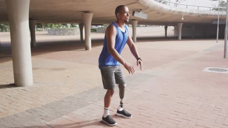 side view man with prosthetic leg doing squats