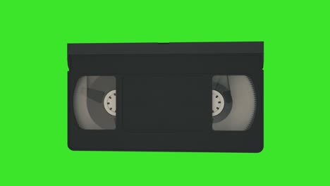 vhs cassette. video cassette spin on a green screen. 4k