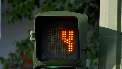 a traffic light countdown from ten to red man figure