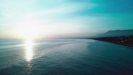 drone flying high at the coast of marbella, south of spain