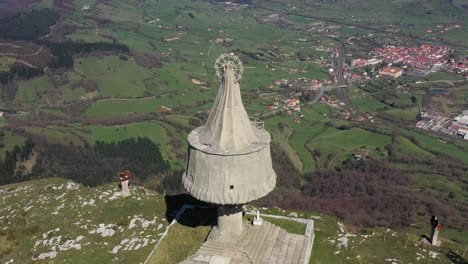 Aerial-drone-view-of-a-large-monument-statue-of-the-Virgin-of-Orduña-on-the-top-of-Mount-Txarlazo-in-the-Basque-Country