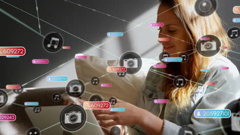 Animation-of-network-of-connections-with-icons-over-caucasian-businesswoman-using-smartphone