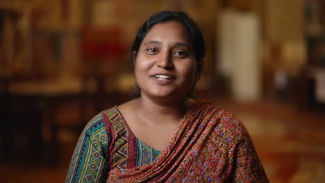 portrait of a smiling south asian woman in traditional attire