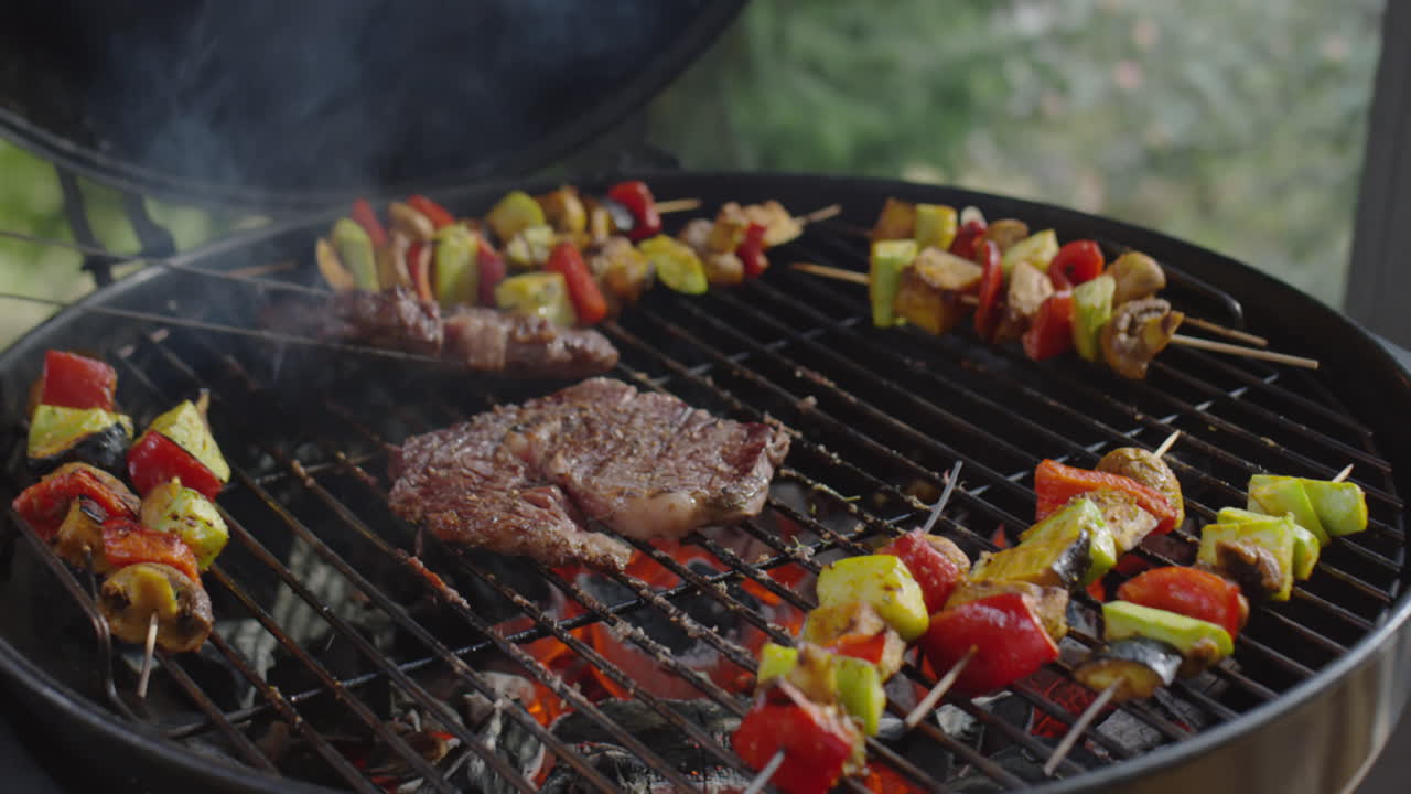 Flipping Meat Steaks on BBQ