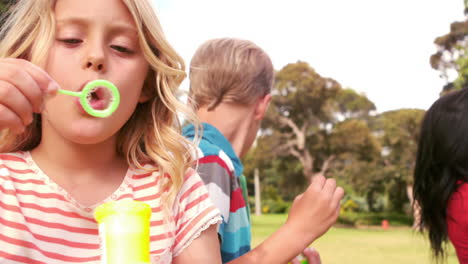 Happy-children-blowing-bubbles