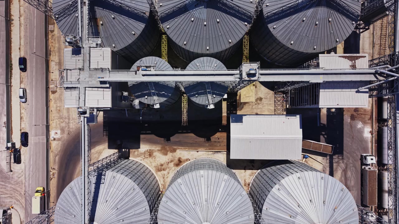Large storage tanks at an industrial site during daylight hours