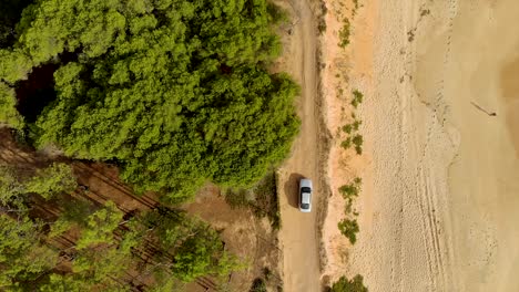 Top-view-of-car-going-to-sandy-trail