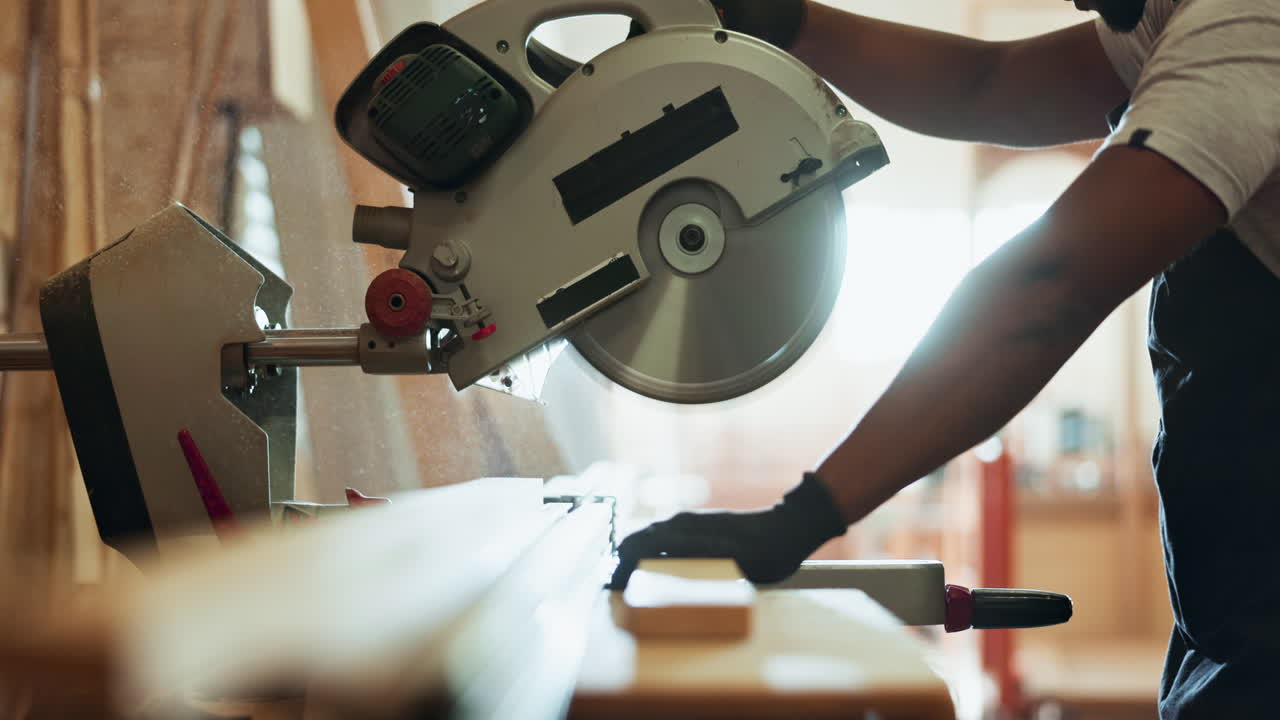 Man using a miter saw for woodworking