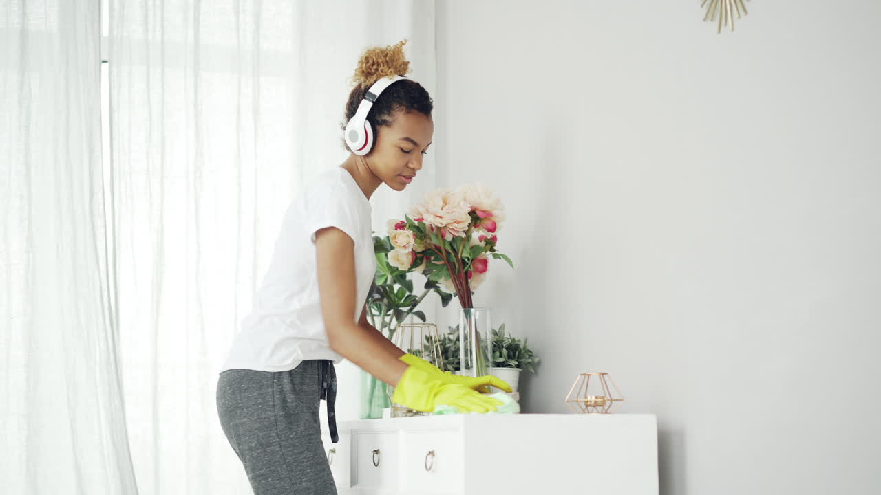 Woman cleaning a table with flowers
