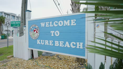 welcome to kure beach sign 4k gimbal shot tracking out