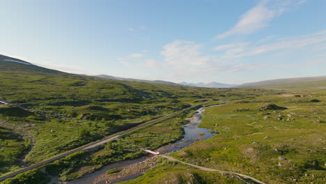 Distant-train-travelling-at-speed-through-Saltfjellet-mountain-pass