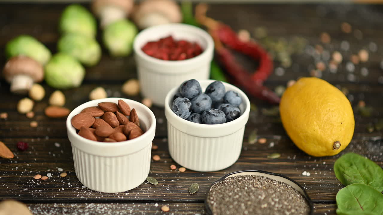 Different types of fruits, vegetables and beans on a wooden surface