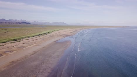 aerial footage of rare golden sand beach during sunny summer in snaefellsness peninsula, iceland