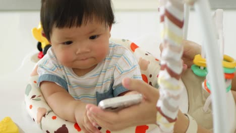 a caring moment as a girl interacts playfully with her baby in a nurturing home.