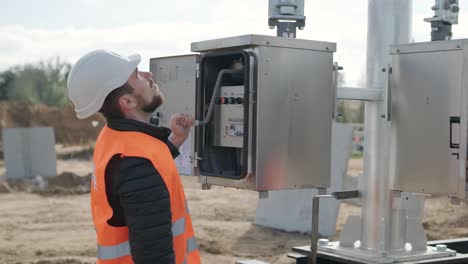 setting up equipment at a transformer substation. construction of a transformer substation