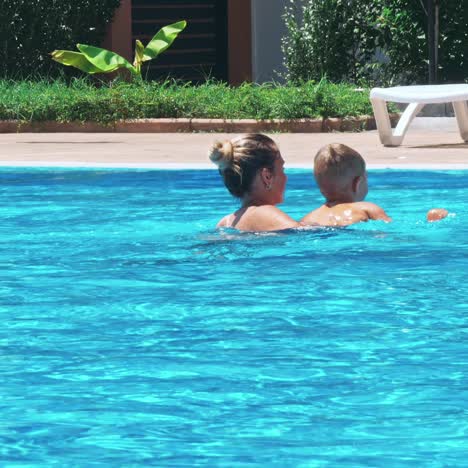 happy family having fun in the swimming pool.