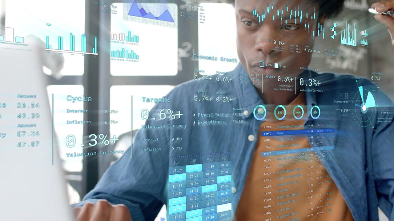 Man leaning forward inspecting display activating holograms over laptop while analyzing tech data