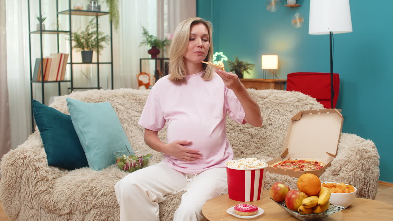 Pregnant woman craving pizza chocolate fruit vegetables chips popcorn with strong pregnancy hunger
