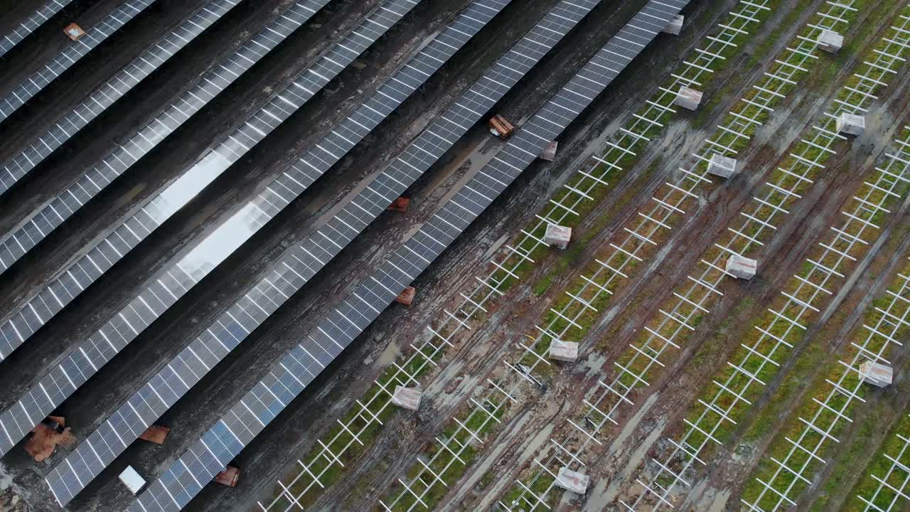 Solar energy farm in Partille, Sweden, wide spinning shot directly above