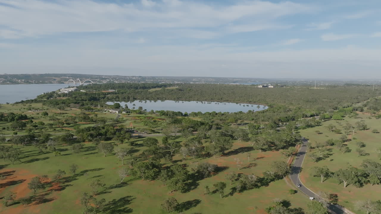 Aerial video over Brasilia's roads flying towards Lagoa do Jaburu in the morning light