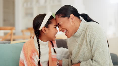 Happy,-relax-and-mother-with-daughter-on-sofa