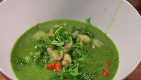 Green-Broth-Made-Of-Cilantro-For-Peruvian-Seafood-Stew-Recipe-With-Shrimps,-Clams,-And-Fish