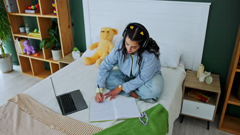 woman studying in her bedroom