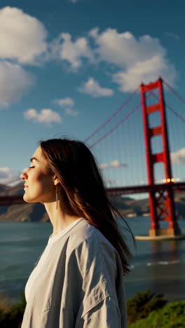 woman gazing at the golden gate bridge