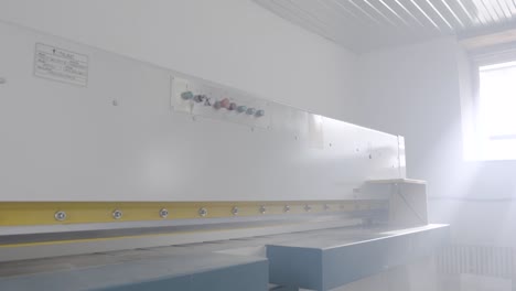 industrial cutting machine in a workshop