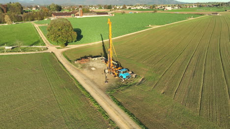 mining exploration drill truck next to borehole forward dolly up boom tilt