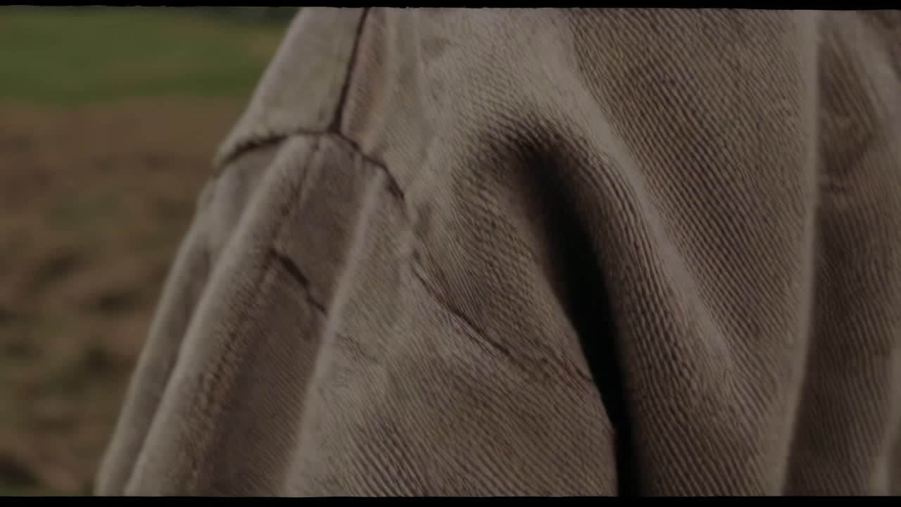 Man in historical clothing in a rural landscape
