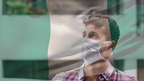 animación de la bandera de italia ondeando sobre un hombre que usa una máscara facial durante la pandemia de covid-19