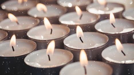 falling snow with christmas candles