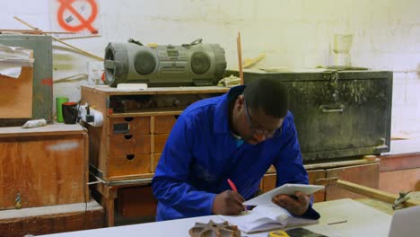 male worker using digital tablet in foundry workshop 4k