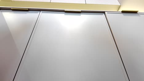 modern white kitchen cabinets with gold handles