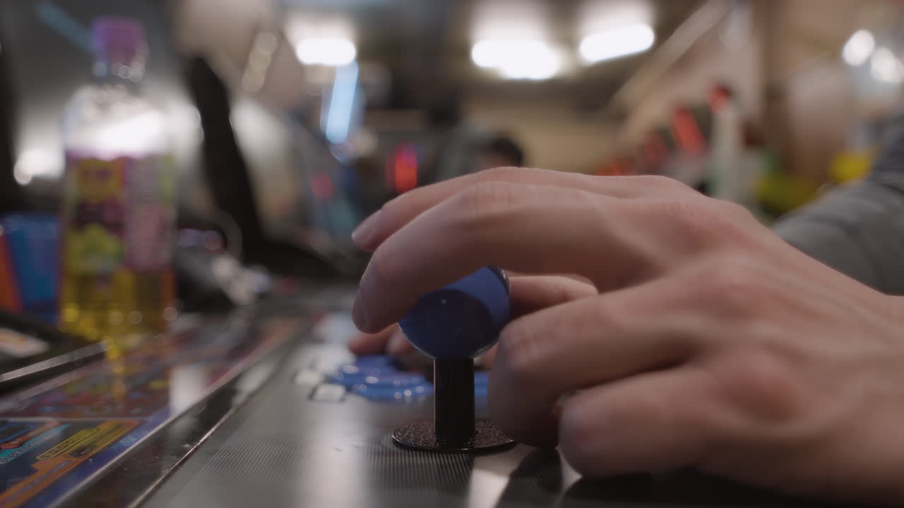 Close up of a male hand using a arcade fight stick, Japan