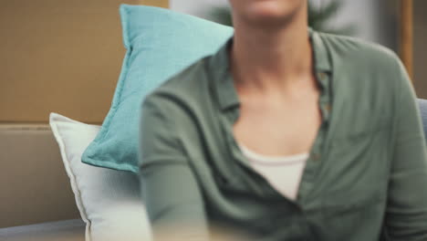 a young woman taking a break while moving house