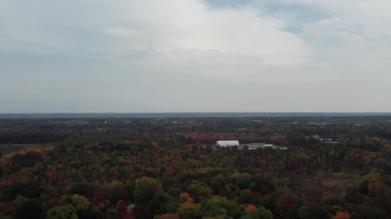 Aerial capture during sunset of small town on cloudy day