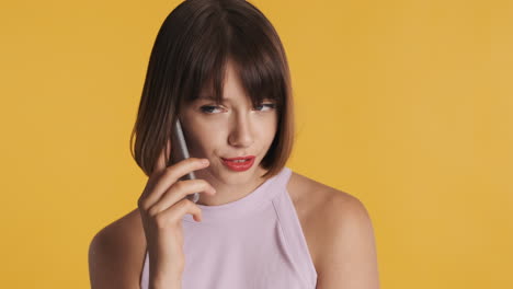 brunette model posing with smartphone