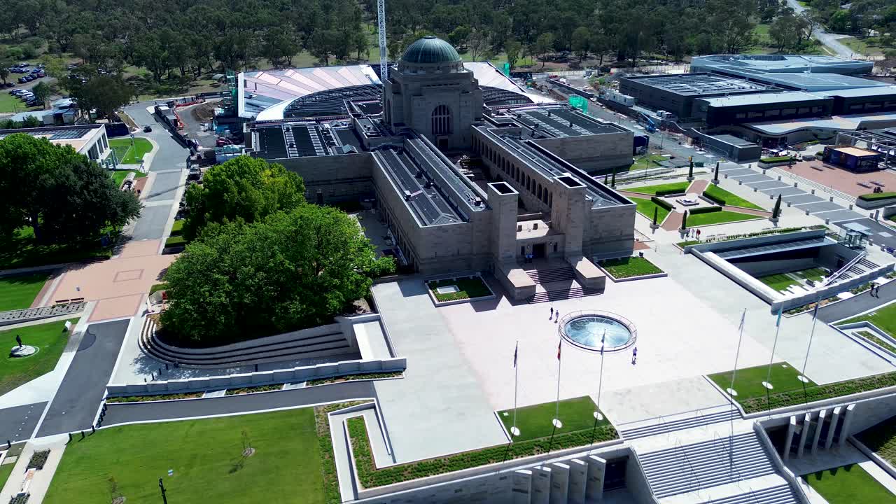 Drone aerial landscape of War Memorial museum building and entrance promenade staircase with flags Canberra city ACT Campbell Reid Australia infrastructure architecture design tourism