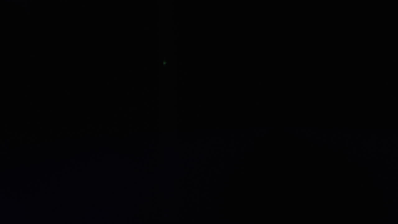 Man Playing Guitar Under Blue Neon Lights