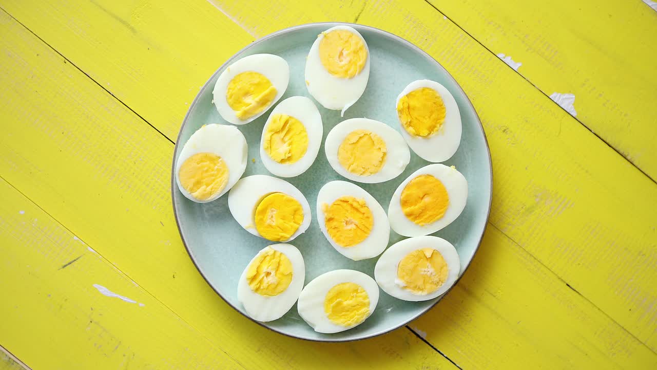 Boiled chicken eggs on a blue ceramic plate  The concept of Easter Holidays