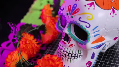 colorful day of the dead skull decoration with vibrant flowers, close up